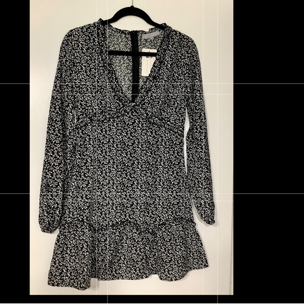 Large black and white long sleeve floral dress. Perfect for all seasons.